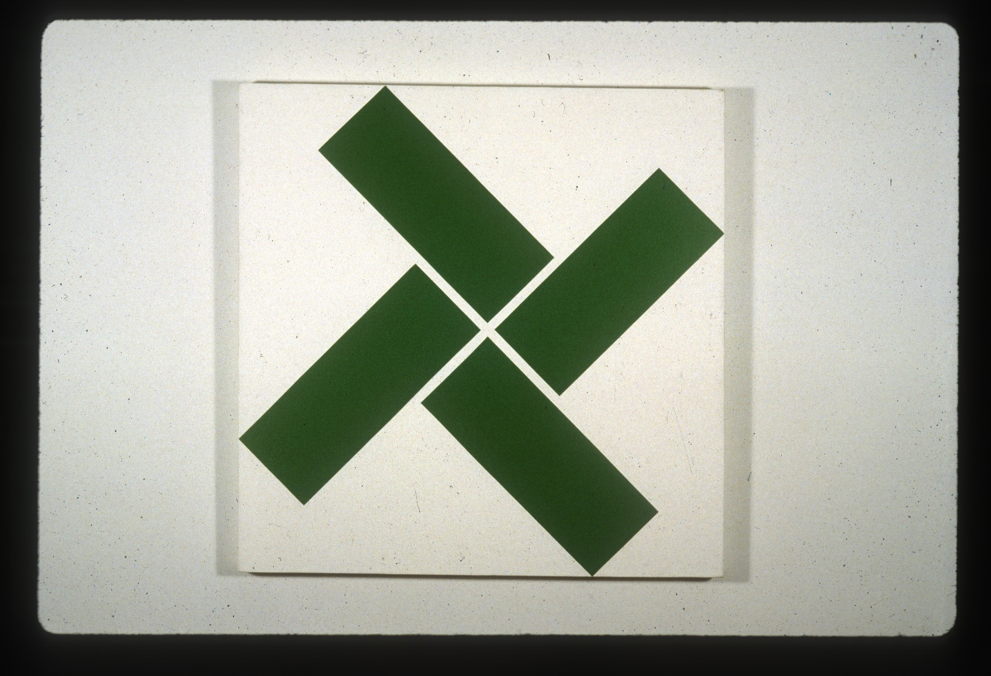 Four green rectangles arranged in a pinwheel formation on a white background.