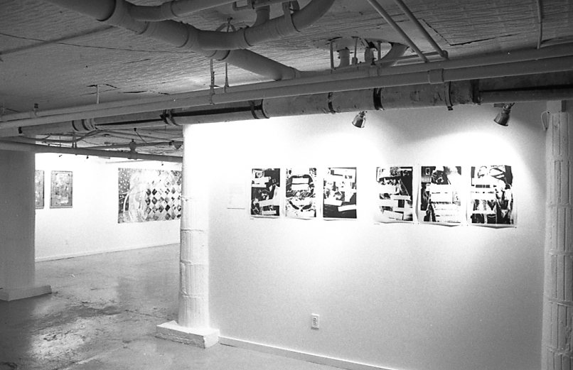 A black and white photograph of mixed media collage work hanging on gallery walls.
