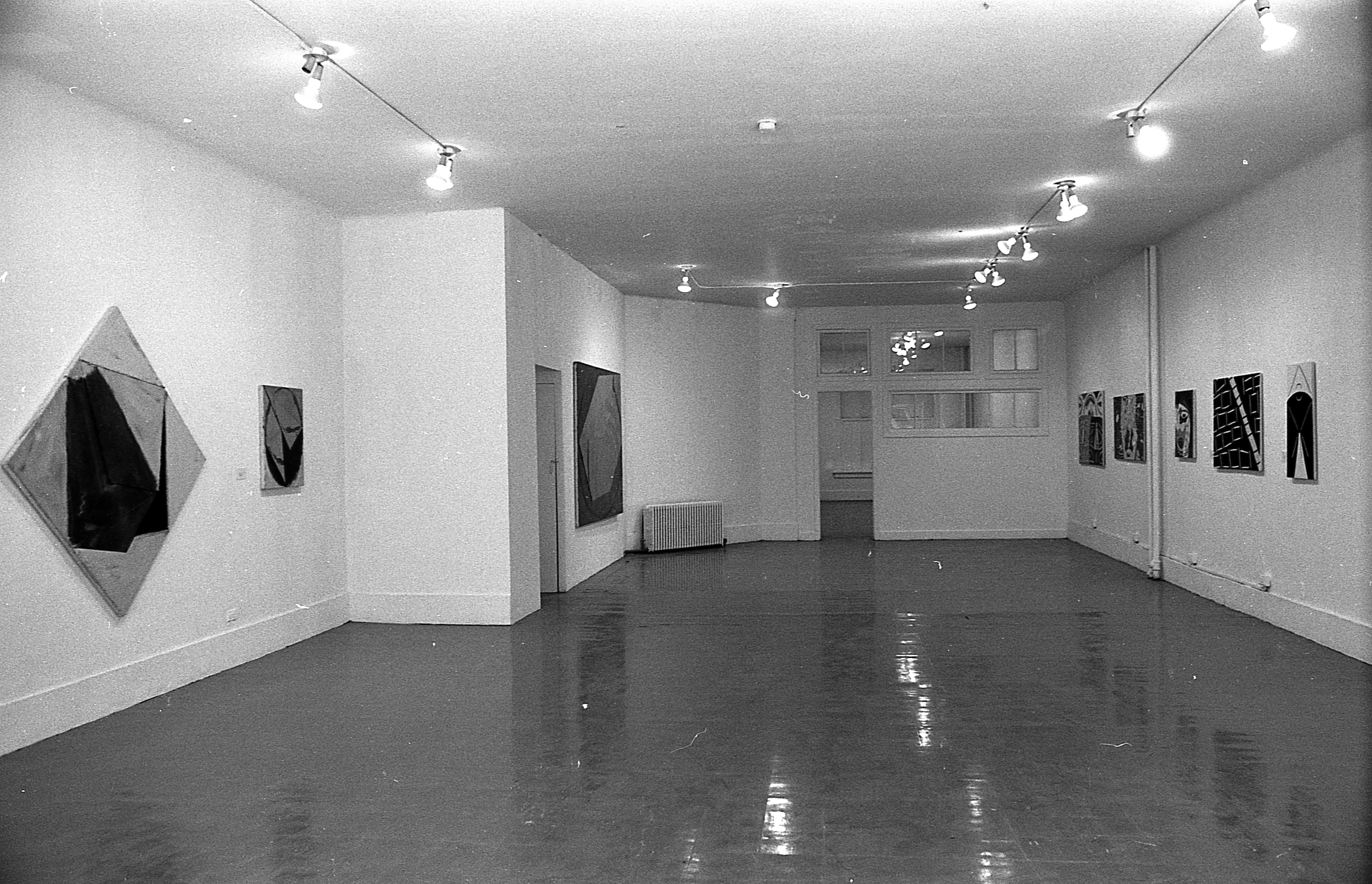 Various paintings hang on the walls to the left and right.