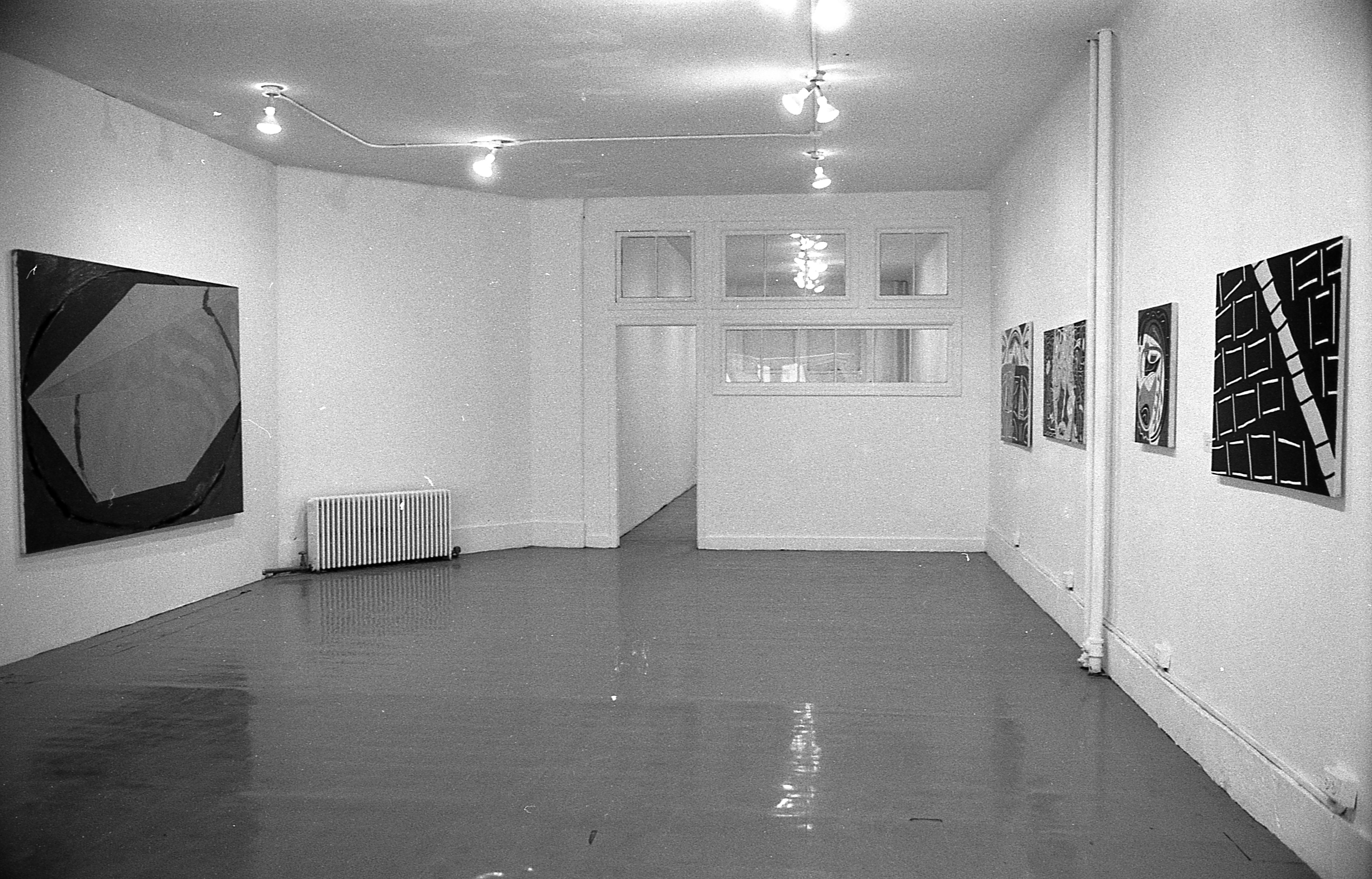 Various paintings hang on the walls to the left and right.