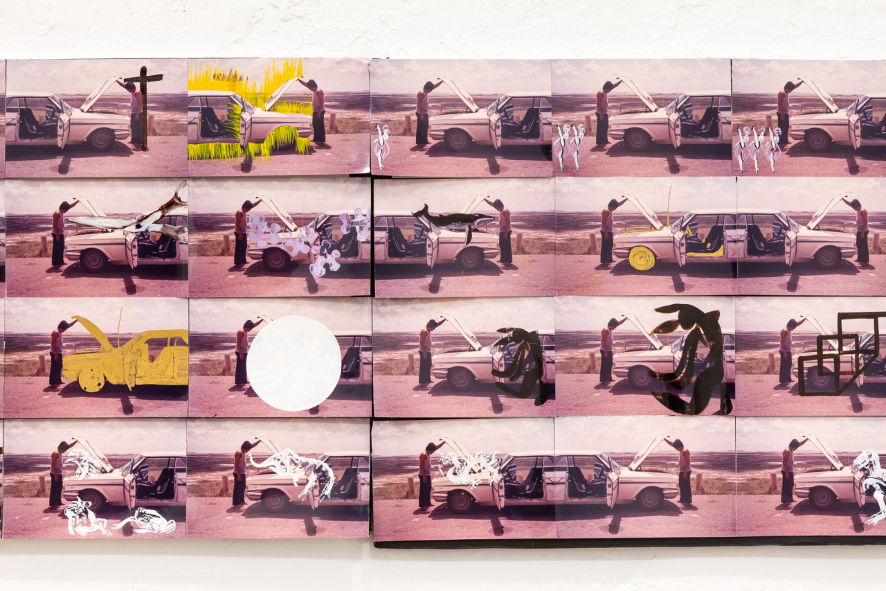 A detail shot of a larger photo collage work featuring 20 identical images in a grid that have been altered with black, yellow, or white paint to vary the scene presented of a man opening up the hood of a car.