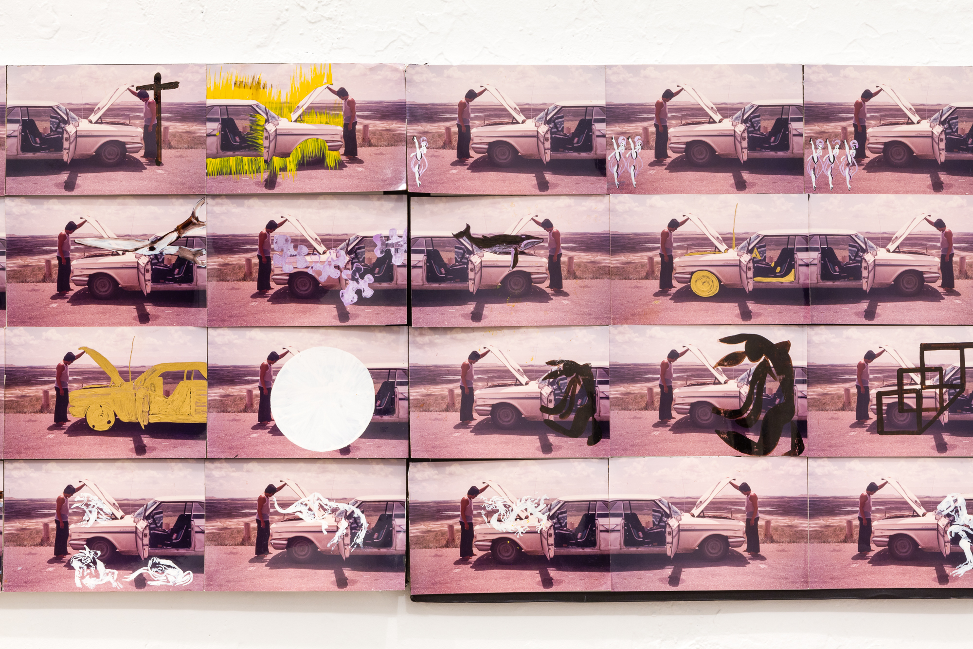 A detail shot of a larger photo collage work featuring 20 identical images in a grid that have been altered with black, yellow, or white paint to vary the scene presented of a man opening up the hood of a car.