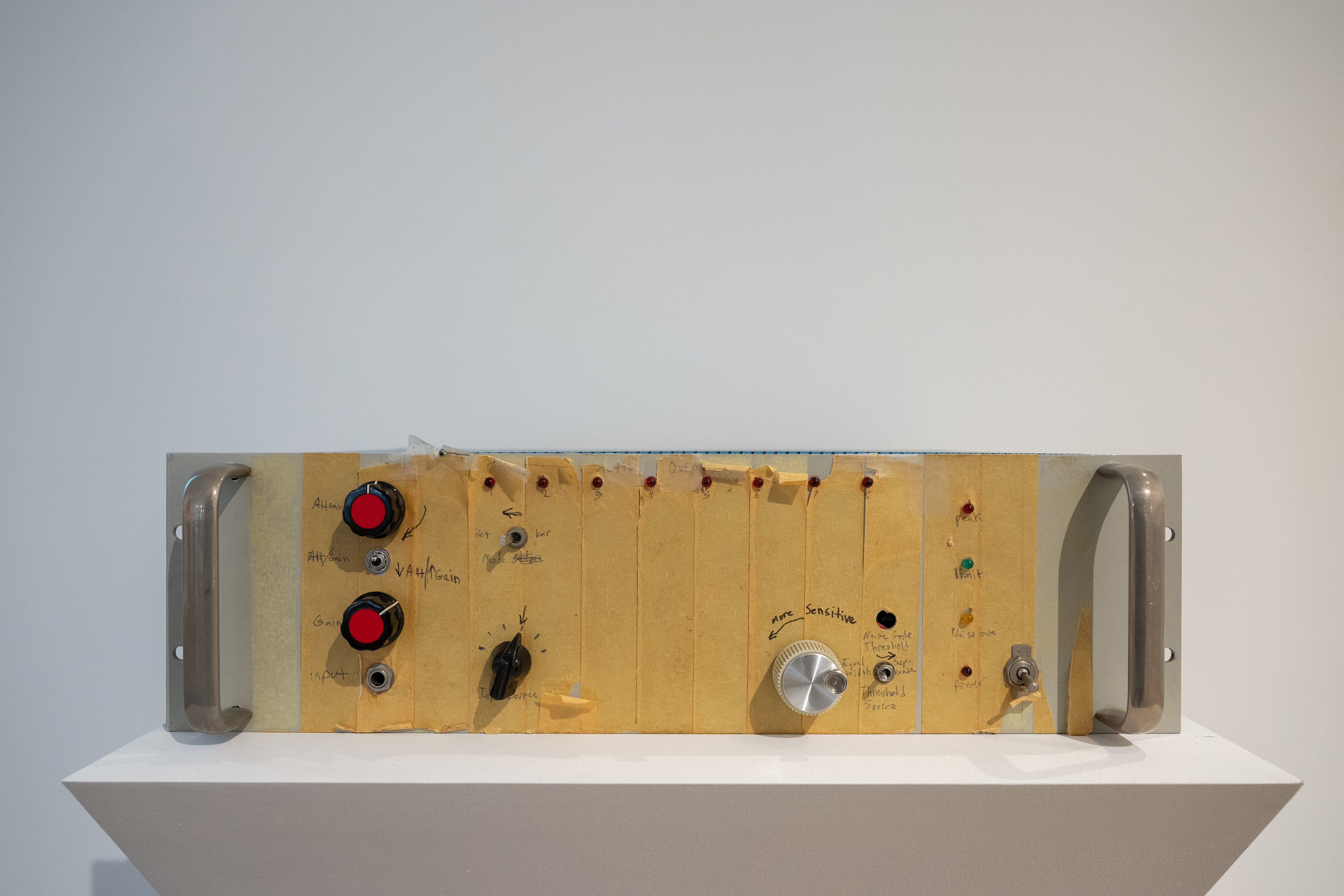 Color photograph of the side of an oscillator box, with various notes written next to all of the controls.