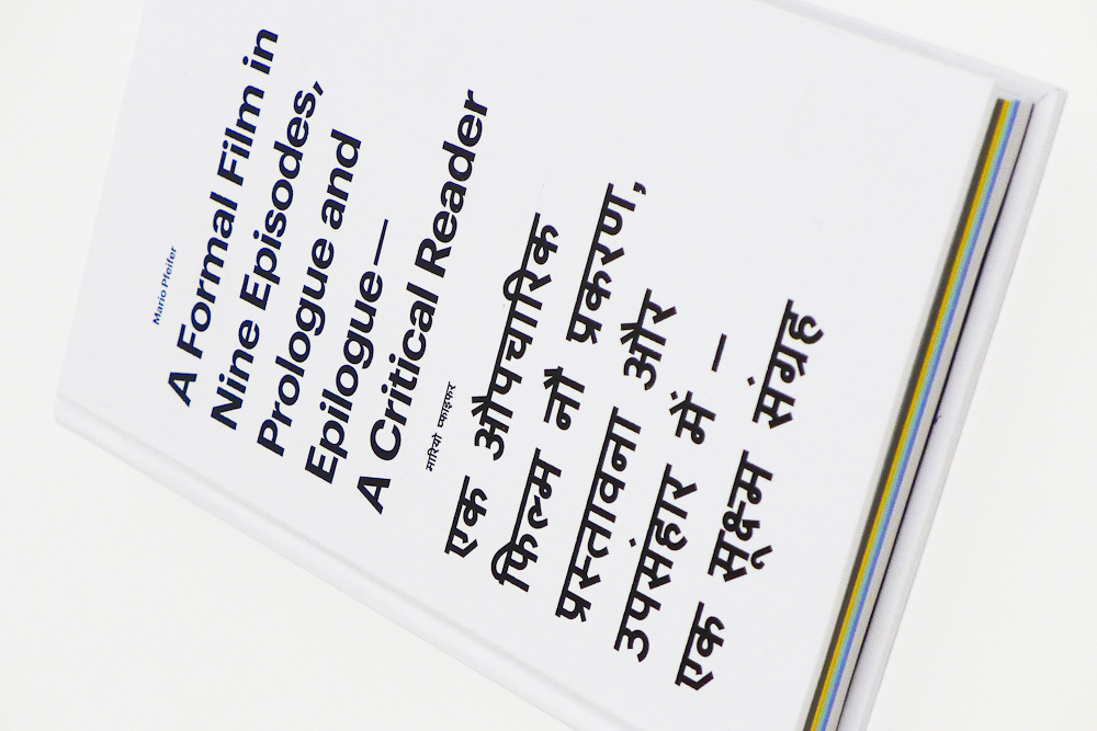 A white book cover with black text in English and Hindi.