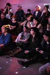 An audience watches a performance.