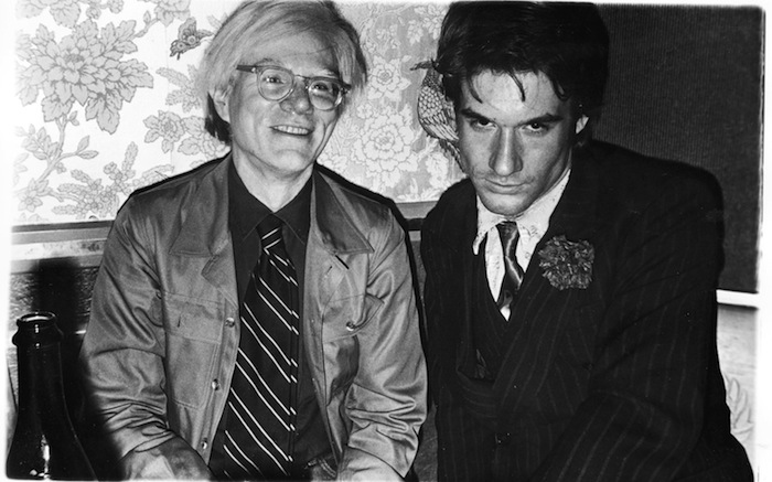 A black and white image of two men facing the camera.