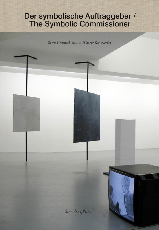 A book cover design. The title "Der symbolische Auftraggeber/The Symbolic Commissioner" is situated at the top of the cover. Below it is an image of two sculptures made of large rectangular panels affixed in midair by metal poles that reach floor to ceiling. To the right of the sculptures is a white plinth, and in front of that, a television on the ground.
