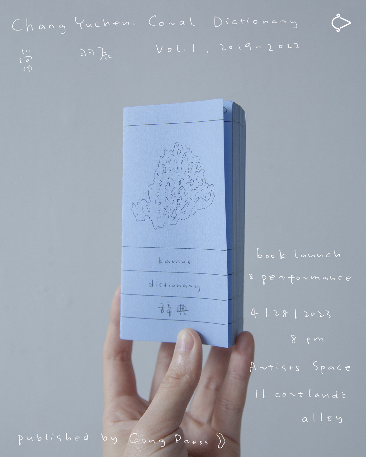 A color image of a hand holding up a small blue book, in front of a solid grey background. White handwritten text is overlayed the image, the text reads: 