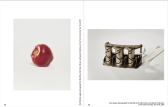 Scan of a spread of two pages in a book. On right-hand page, a red apple sits on its side. The right-hand page features an image of a coin changer with a white paper tag attached to it.