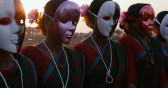 Five figures wearing masks and pearl necklaces tied in a looped knot stand in a row amidst a landscape at dusk.