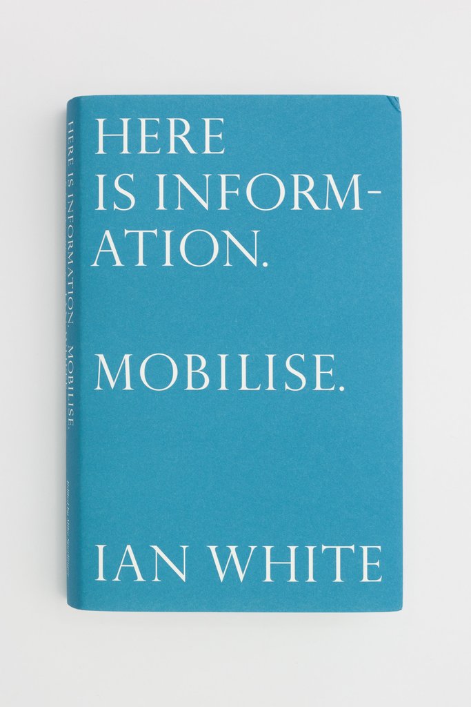 A blue book cover with white text that reads "Here is Information. / Mobilise. / Ian White."