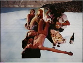 Six people are seated and lounging in a digitally rendered landscape.