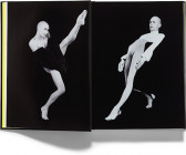 An open book showing two black and white images. On the left, a person with a fur on his arms extends one leg into the air. On the right, the same person wears a unitard and hinges back with one leg straightened in front of him.