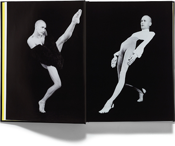 An open book showing two black and white images. On the left, a person with a fur on his arms extends one leg into the air. On the right, the same person wears a unitard and hinges back with one leg straightened in front of him.