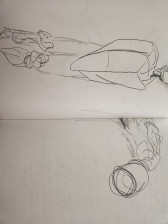 A notebook spread featuring pencil drawings on paper.