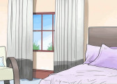 A cartoon drawing of a bedroom with a purple bed, chair, and window