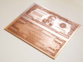 A printing plate for a $100,000 bill, featuring a portrait of Woodrow Wilson.