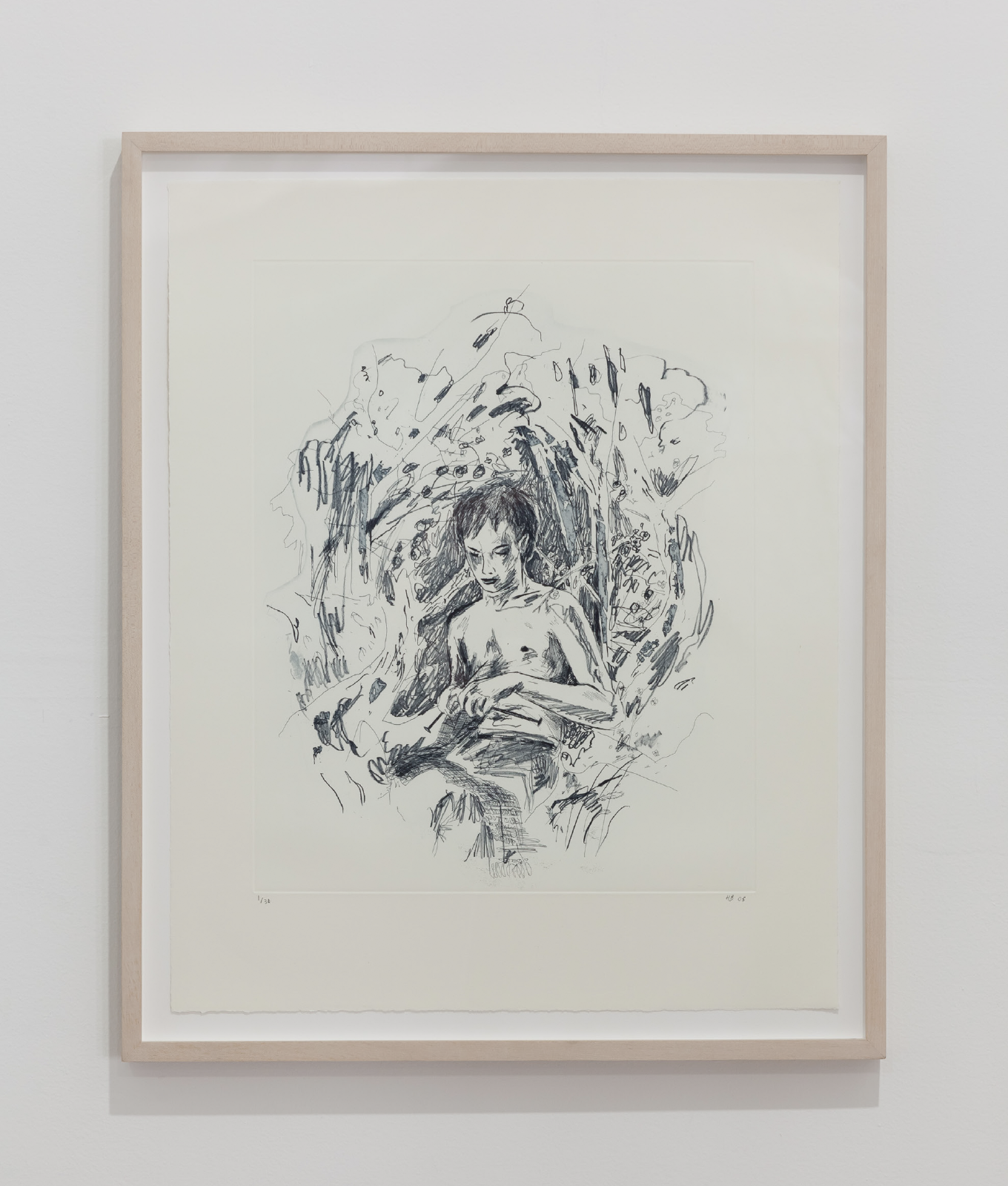 A wood framed drawing hangs on a wall. The pencil drawing depicts a youthful figure at the center of the page with abstract pencil markings surrounding them.
