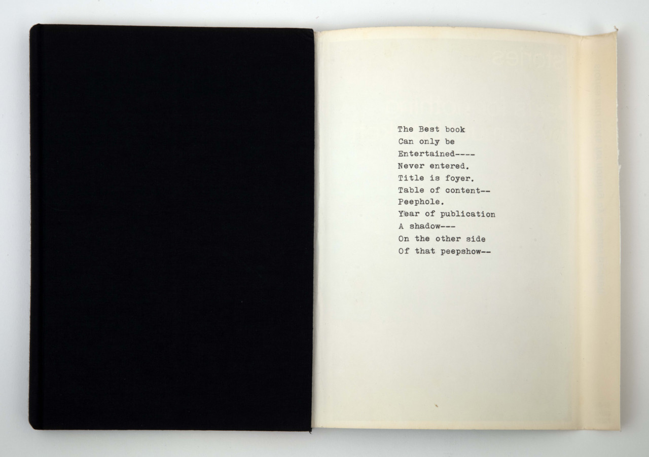 A black cloth-lined hardcover book is closed, with the verso of its dustjacket splayed open to the right, revealing a typewritten poem. The text reads: "The Best book / Can only be / Entertained---- / Never entered. / Title is foyer. / Table of content-- / Peephole. / Year of publication / A shadow--- / On the other side / Of that peepshow--"